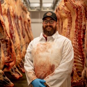 Jacob Williams owner of Harvester Meat Company standing in processing facility