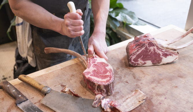 A clients cuts up steaks in Champaign IL